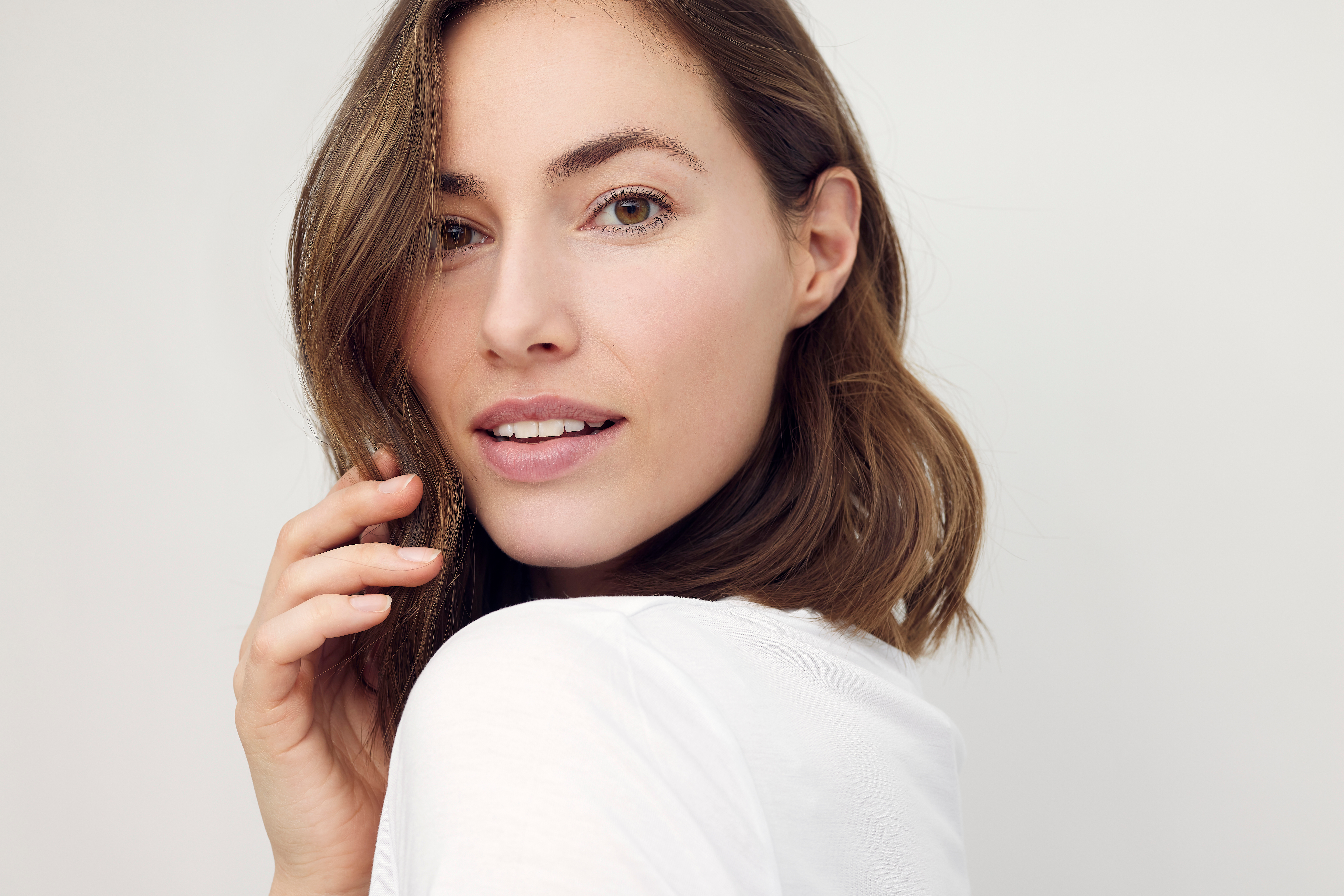 Woman with smooth, youthful skin after Sofwave treatment